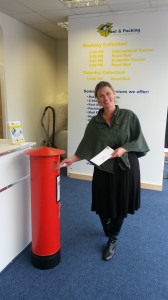 Customer using post box at Tunbridge Wells Store